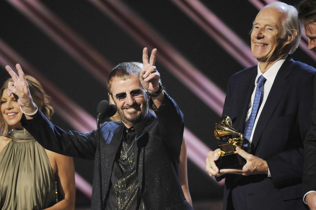 Ringo Starr, center, and Beatles producer Sir George Martin accept the best compilation soundtrack album award for &quot;Love&quot; during the 50th annual Grammy awards Feb. 10, 2008, held at the Staples Center in Los Angeles.