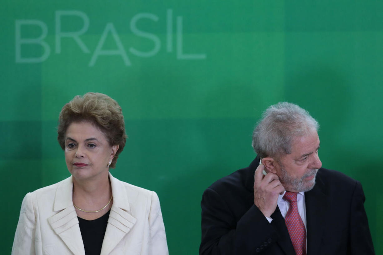 Brazilian President Dilma Rousseff, left, and former President Luiz Inacio Lula da Silva attend his swearing-in ceremony as chief of staff Thursday at the Planalto presidential palace in Brasilia, Brazil.