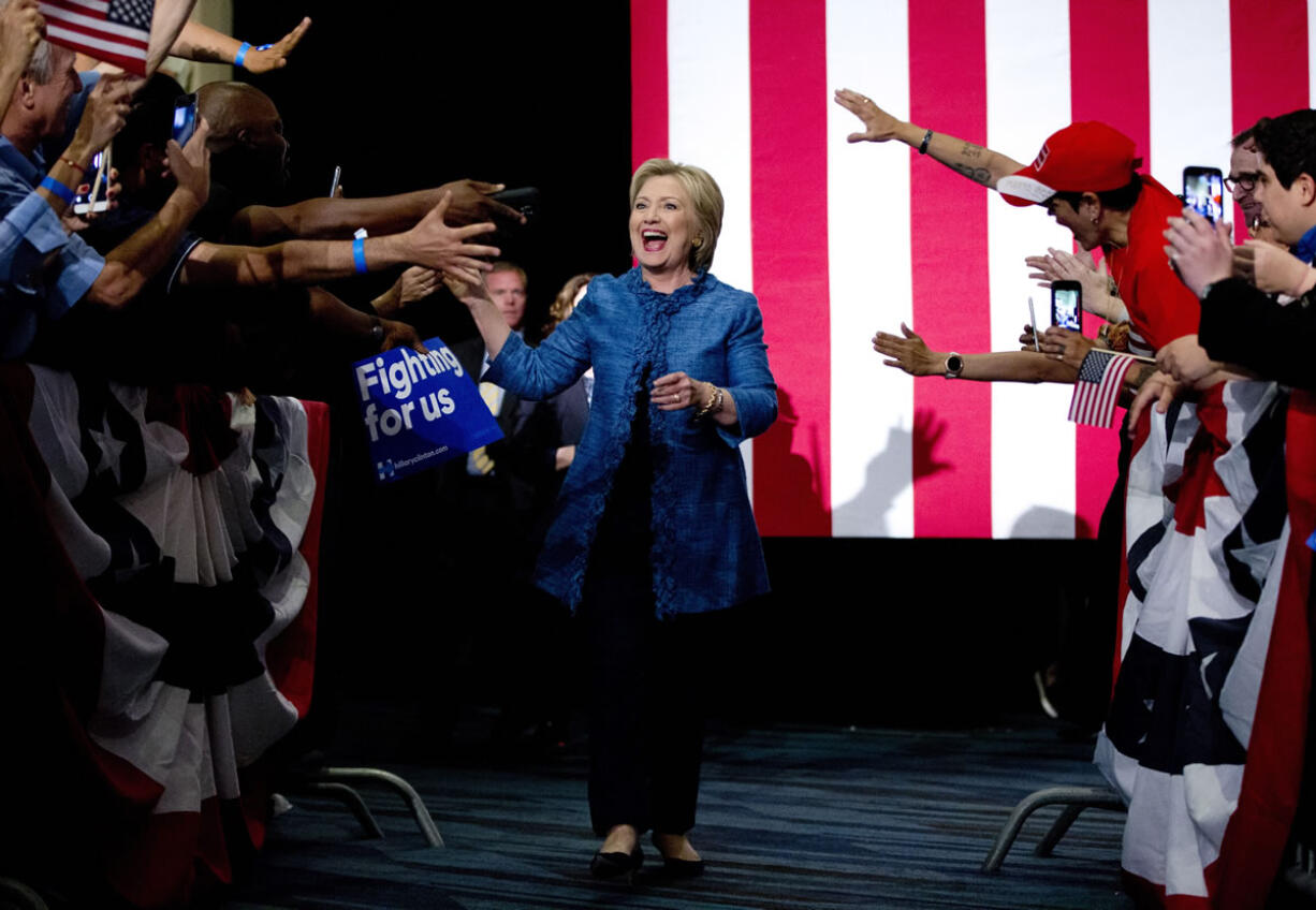 Democratic presidential candidate Hillary Clinton arrives to a cheering crowd as she arrives at an election night event at the Palm Beach County Convention Center in West Palm Beach, Fla., Tuesday.