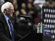 Democratic presidential candidate Bernie Sanders smiles as a bird lands on his podium when he addresses the crowd during a rally March 25 at the Moda Center in Portland.