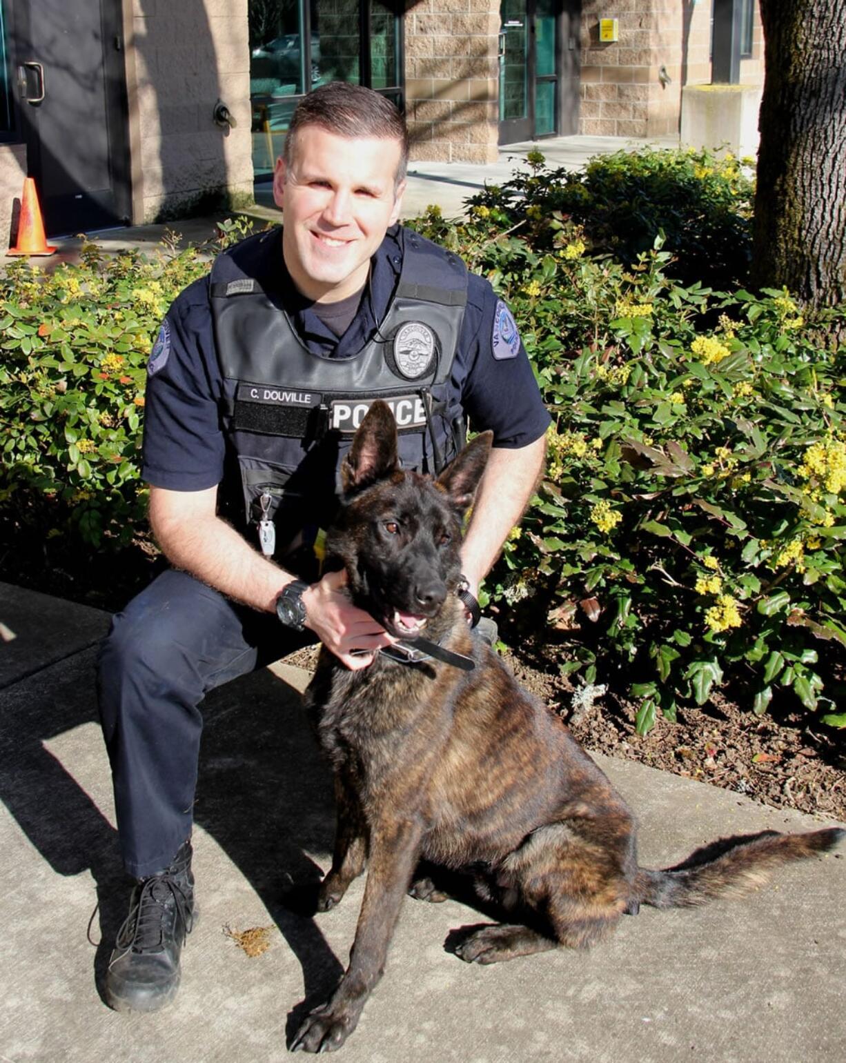 Officer Christopher Douville and Doc both recently join the Vancouver Police Office K-9 Unit. Doc, a 2-year-old Dutch Shepherd, is named in honor of Douville's father.