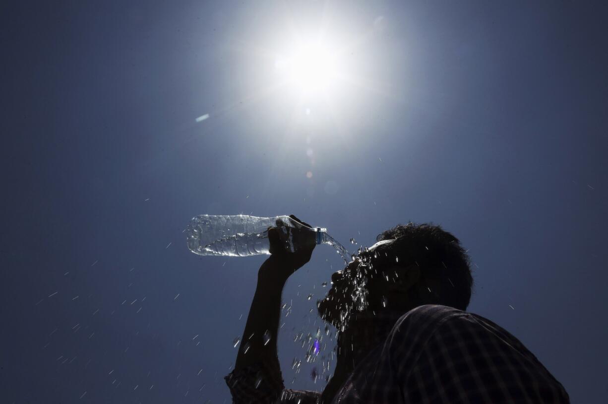 A man cools off during a hot day in Hyderabad, India, in May 2015.