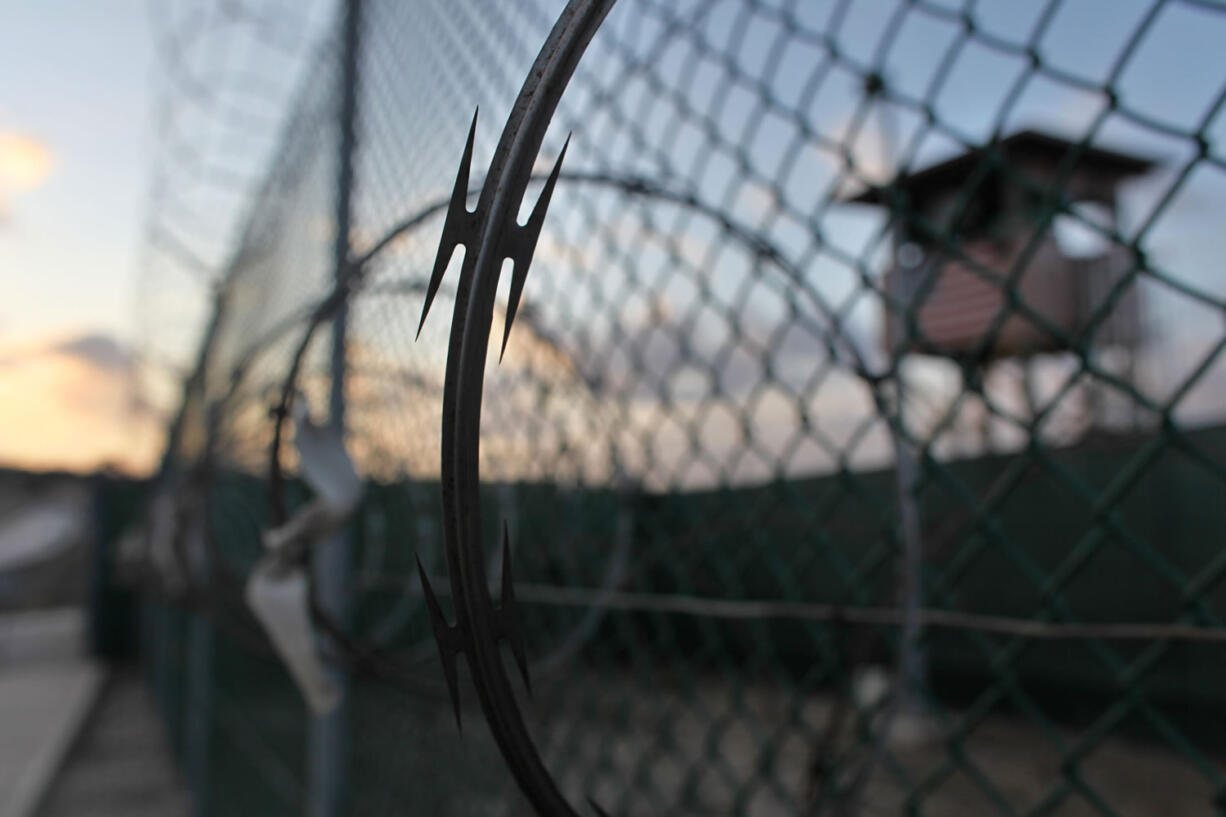 In this May 2009 file photo reviewed by the U.S. military, the sun rises over the Guantanamo detention facility at dawn, at the Guantanamo Bay U.S. Naval Base, Cuba.  In the last comprehensive review of prisoners held at Guantanamo Bay, the U.S. government decided nearly 50 were "too dangerous to transfer but not feasible for prosecution," leaving them in an open-ended legal limbo. Now in 2016, it seems many may not be so dangerous after all.