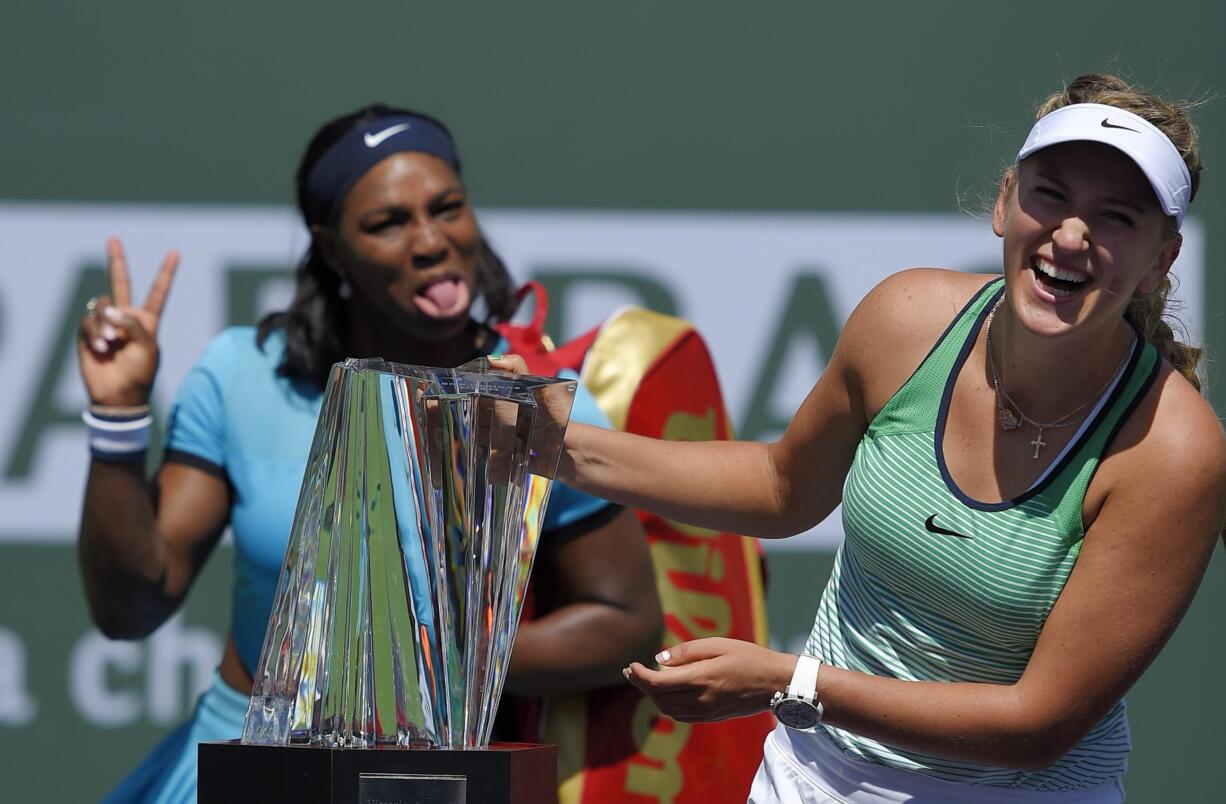 Serena Williams, left, jokes behind Victoria Azarenka, of Belarus, after Azarenka defeated her in a final at the BNP Paribas Open tennis tournament, Sunday, March 20, 2016, in Indian Wells, Calif. Azarenka won 6-4, 6-4. (AP Photo/Mark J.