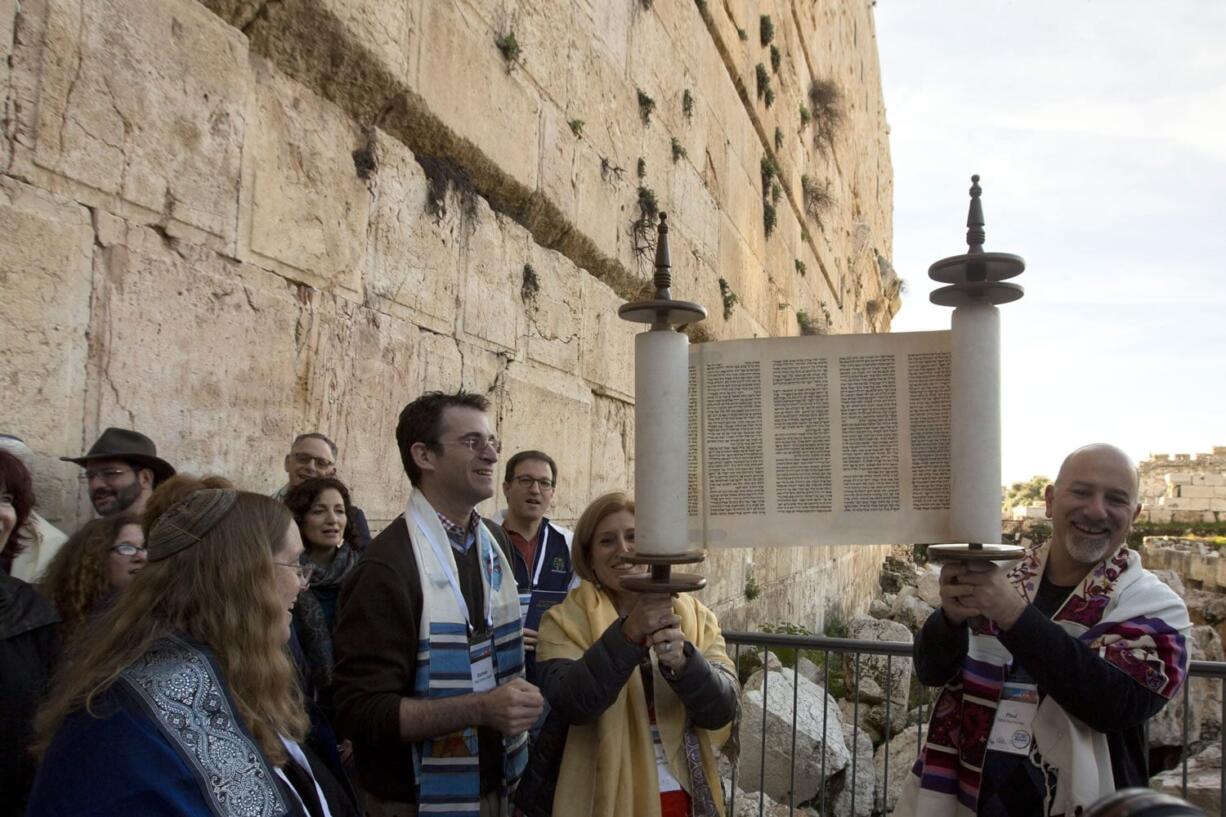 American Reform Rabbi Zachary Shapiro, center left, and other American and Israeli Reform rabbis pray Feb. 25 in the Western Wall, the holiest site where Jews can pray in Jerusalem&#039;s old city.