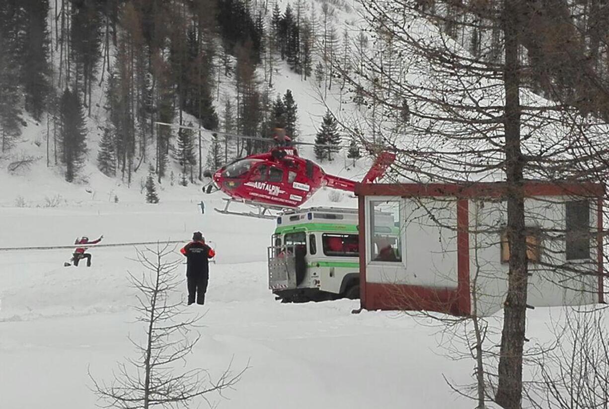 A rescue helicopter takes off  in Valle Aurina, in the Italian Alps, in order to reach the spot in Monte Nevoso where six backcountry skiers have died in an avalanche Saturday, March 12, 2016. The dead were in a group of backcountry excursionists who climb above tree line to the mountain crest and then ski down.