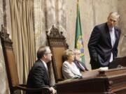 Gov. Jay Inslee, right, thanks Lt. Gov. Brad Owen, left, for his service Tuesday after Owen announced to the Senate that he was retiring at the end of his term.