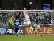 Portland Timbers goalkeeper Adam Larsen Kwarasey (12) is beaten for a goal on a high shot from San Jose Earthquakes forward Quincy Amarikwa (25) during the first half of an MLS soccer match Sunday, March 13, 2016, in San Jose, Calif.