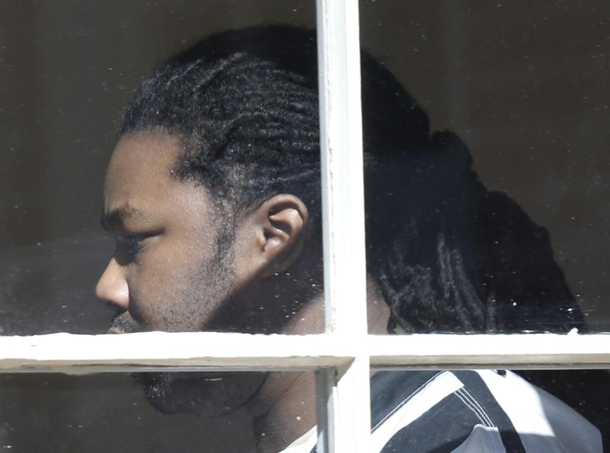 Jesse Matthew Jr. walks out of court after pleading guilty to the abduction and murders of two college students Wednesday in Charlottesville, Va.