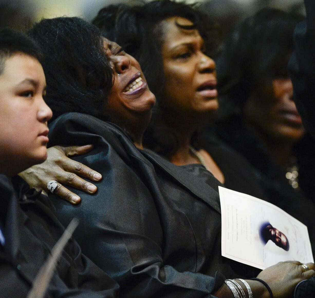 Kimberly Gunn cries at the funeral service for her brother Gregory Gunn at True Divine Baptist Church in Montgomery, Ala., Saturday, March 5, 2016. Gregory Gunn was fatally shot by Montgomery Police Officer Aaron Smith on Feb. 25. Smith has been arrested.