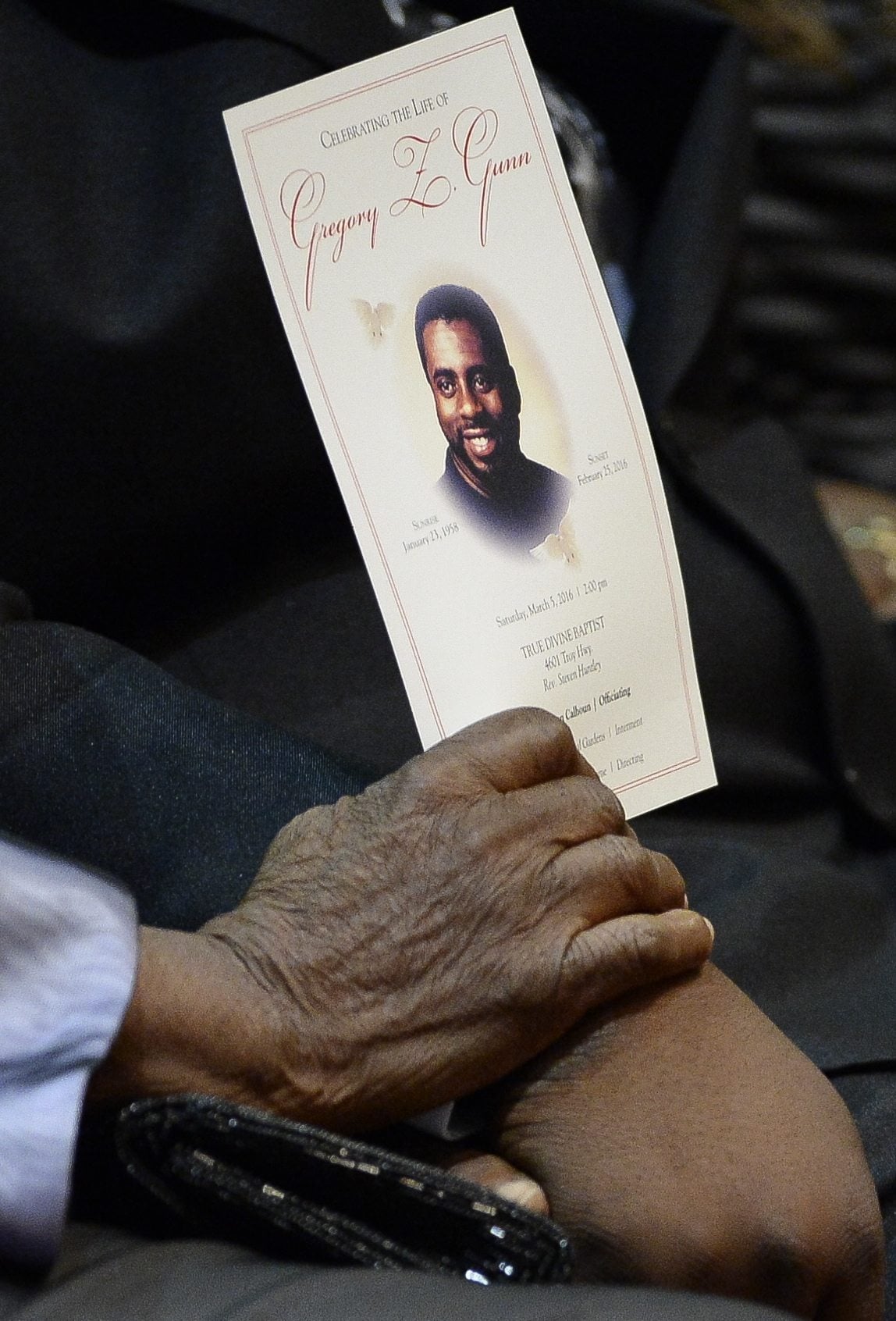 Nellie Ruth Gunn holds a program at the funeral service for her son Greg Gunn at True Divine Baptist Church in Montgomery, Ala., Saturday, March 5, 2016. Gregory Gunn was fatally shot by Montgomery Police Officer Aaron Smith on Feb. 25. Smith has been arrested.