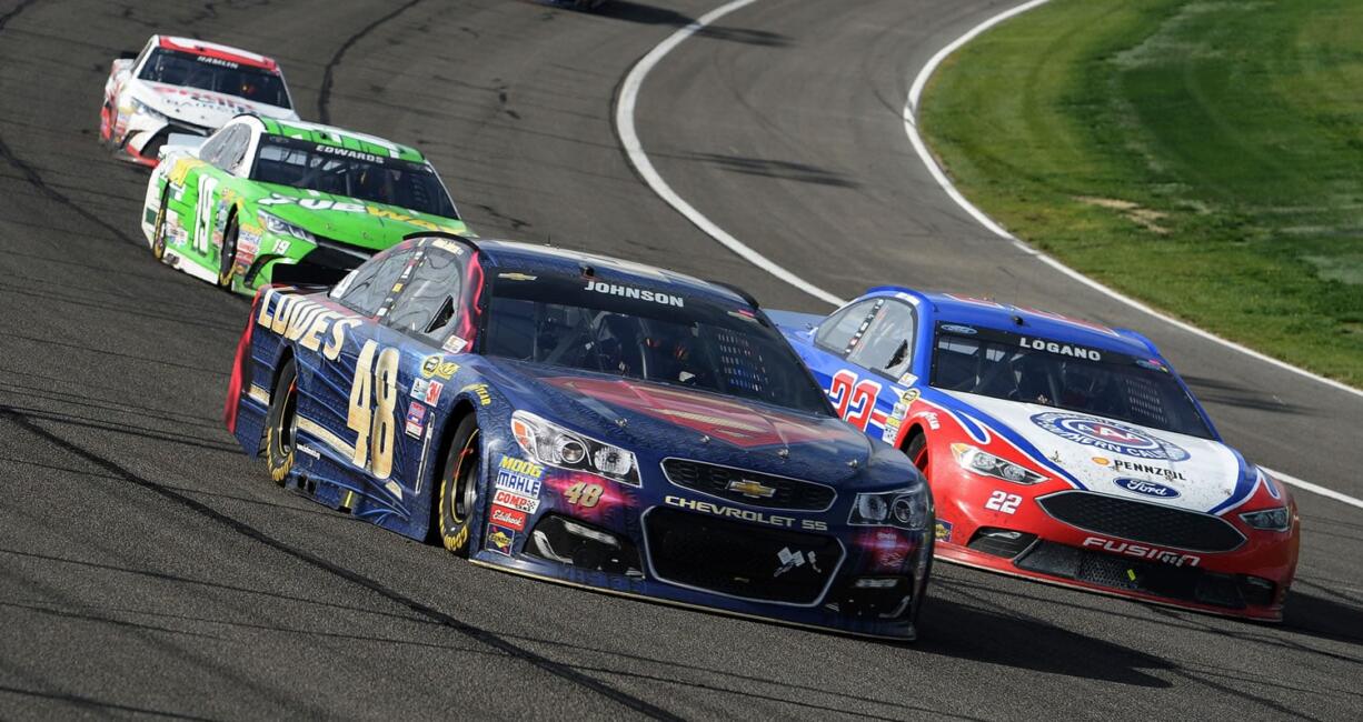 Jimmie Johnson (48) and Joey Logana (22) race for the lead during the late laps of the NASCAR 400 mile auto race Sunday, March 20, 2016, at Auto Club Speedway in Fontana, Calif.