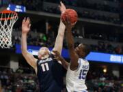 Seton Hall guard Isaiah Whitehead, right, drives for a shot as Gonzaga forward Domantas Sabonis defends during the second half of a first-round men's college basketball game Thursday, March 17, 2016, in the NCAA Tournament in Denver. Gonzaga won 68-52.