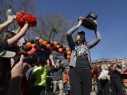 Oregon State center Ruth Hamblin carries the regional championship trophy as the team is greeted by fans in Corvallis, Ore., on Tuesday, March 29, 2016. Oregon State faces Connecticut in the NCAA women&#039;s basketball tournament Final Four in Indianapolis on Sunday.