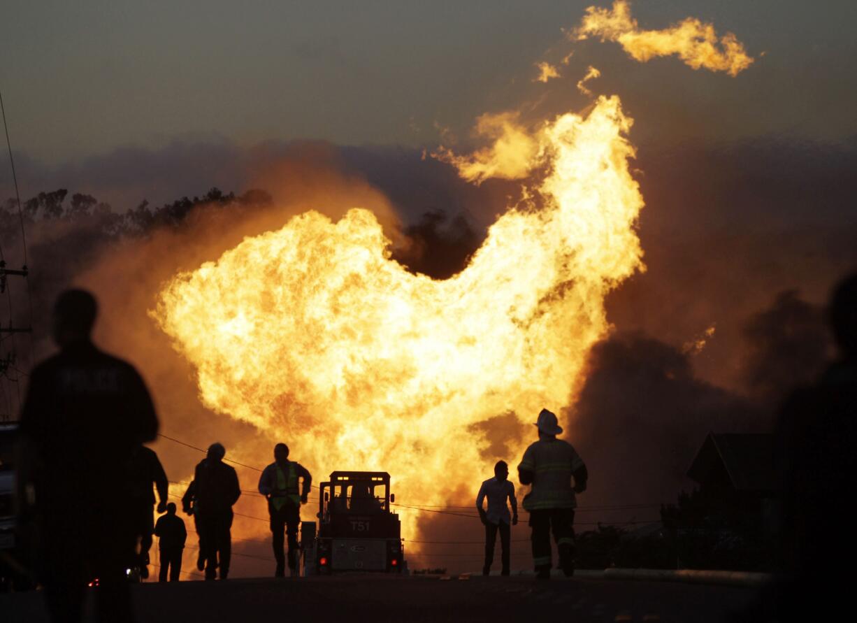 A massive fire roars through a neighborhood in San Bruno, Calif., in 2010. U.S. officials are moving to strengthen natural gas pipeline safety rules following decades of fiery accidents including the 2010 California explosion that killed 8 people and injured more than 50.