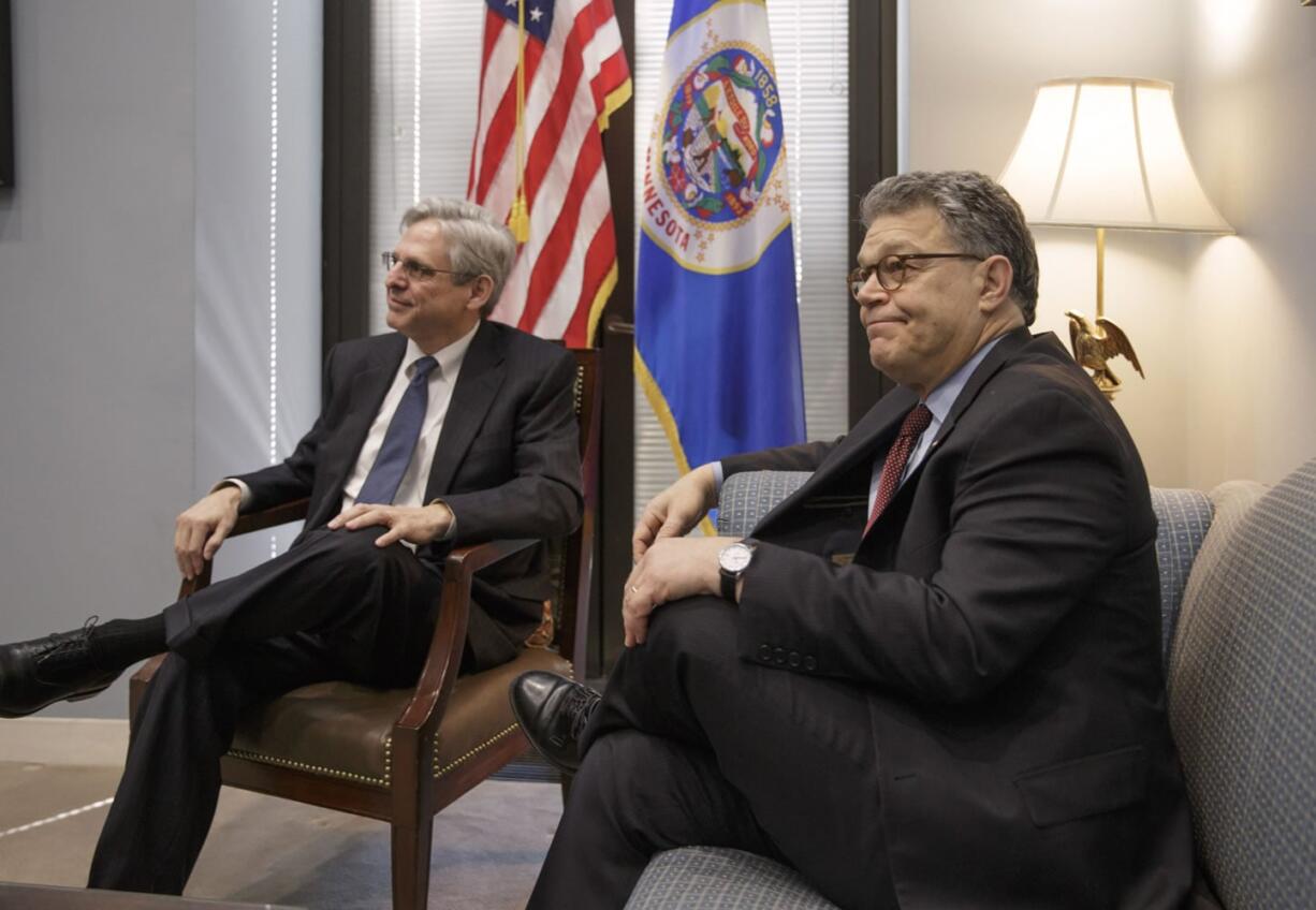 Judge Merrick Garland, left, President Barack Obama?s choice to replace the late Justice Antonin Scalia on the Supreme Court, meets with  Senate Judiciary Committee member Sen. Al Franken, D-Minn.  on Capitol Hill in Washington, Wednesday, March 30, 2016.    (AP Photo/J.