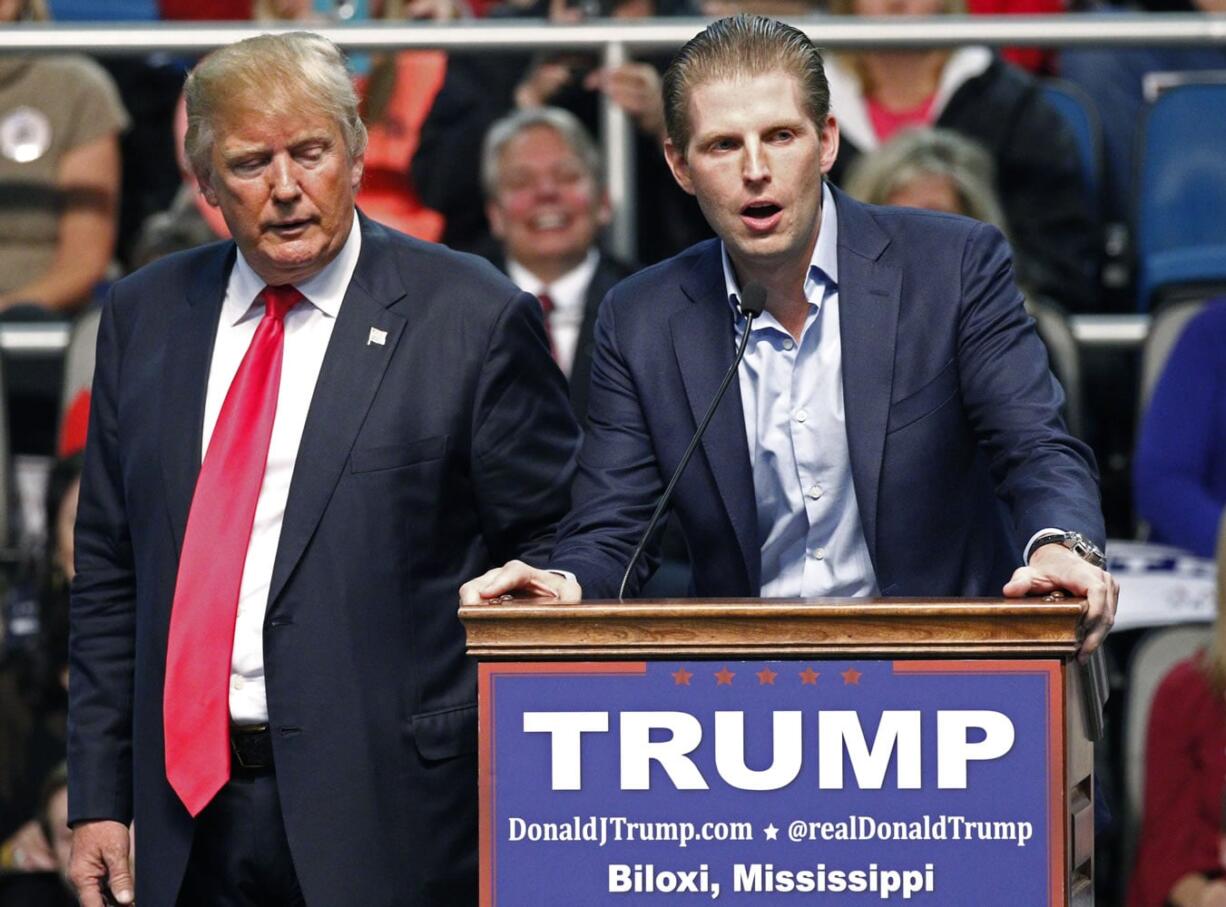 Republican presidential candidate Donald Trump, left, listens as his son Eric Trump speaks Jan. 2 during a rally in Biloxi, Miss. A law enforcement official says New York City police and the FBI are investigating a threatening letter sent to the Manhattan apartment of Eric Trump. The official says the envelope sent to Eric Trump&#039;s apartment on Thursda contained a suspicious white powder and a threatening letter. There were no injuries and the official said preliminary tests indicated that the white substance was not hazardous. (AP Photo/Rogelio V.