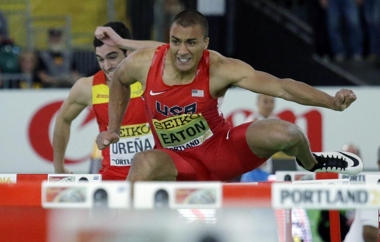 United States&#039; Ashton Eaton competes next to Spain&#039;s Jorge Ure?a, left, in a heat of the men&#039;s 60-meter hurdles of the heptathlon during the World Indoor Athletics Championships, Saturday, March 19, 2016, in Portland, Ore. Eaton won the heat.