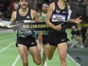 Matthew Centrowitz, on right, breaks the tape ahead of Robby Andrews to with the men&#039;s 1500 meters at the U.S. indoor track and field championships in Portland, Ore., Saturday, March 12, 2016.