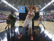 Washougal High School’s Katilyn Reijonen attempts a shot against a Shorecrest High School defender in the fourth quarter of their game in the state girls’ class 2A basketball tournament March 3, 2016 in the Yakima SunDome. Washougal lost to Shorecrest 59-42.