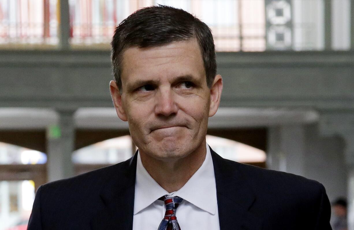 Washington Auditor Troy Kelley walks into the federal courthouse for a June hearing on tax evasion charges he faces. Kelley, the first Washington state official indicted in more than three decades, faces a federal trial Monday with hopes of persuading a jury that the $1.4 million he's accused of stealing wasn't actually stolen.