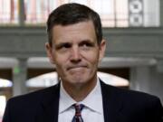 Washington Auditor Troy Kelley walks into the federal courthouse for a June hearing on tax evasion charges he faces. Kelley, the first Washington state official indicted in more than three decades, faces a federal trial Monday with hopes of persuading a jury that the $1.4 million he's accused of stealing wasn't actually stolen.
