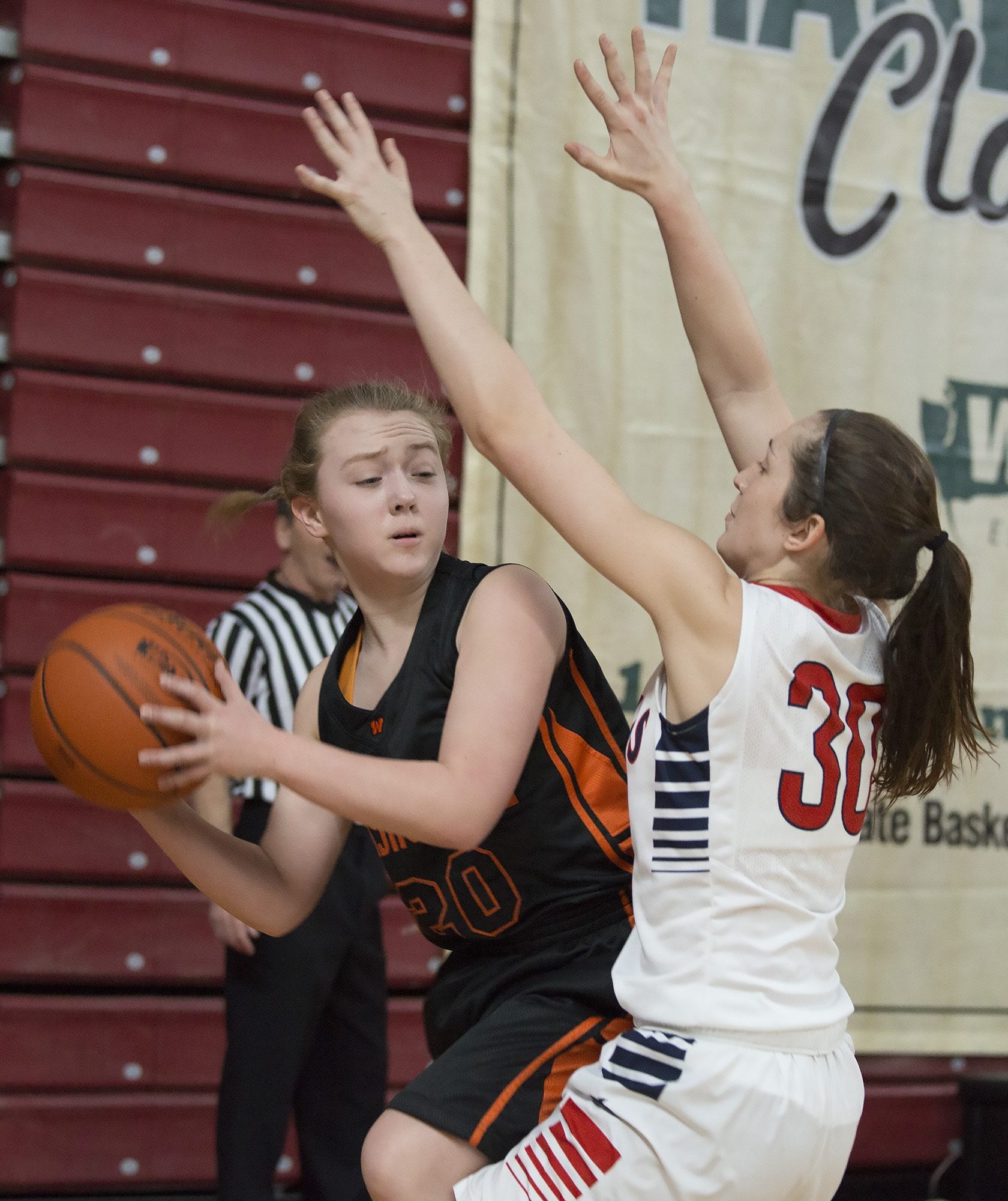 Washougal High School’s Kiara Cross, left, looks to pass against the defense of Black Hills High School’s Lindsey Nurmi in the first half of their game in the class 2A girls state basketball tournament March 5, 2016 in the Yakima SunDome in Yakima, Wash.