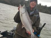 Randy Christianson of Auburn, Wash., holds a spring chinook caught recently near Cathlamet.