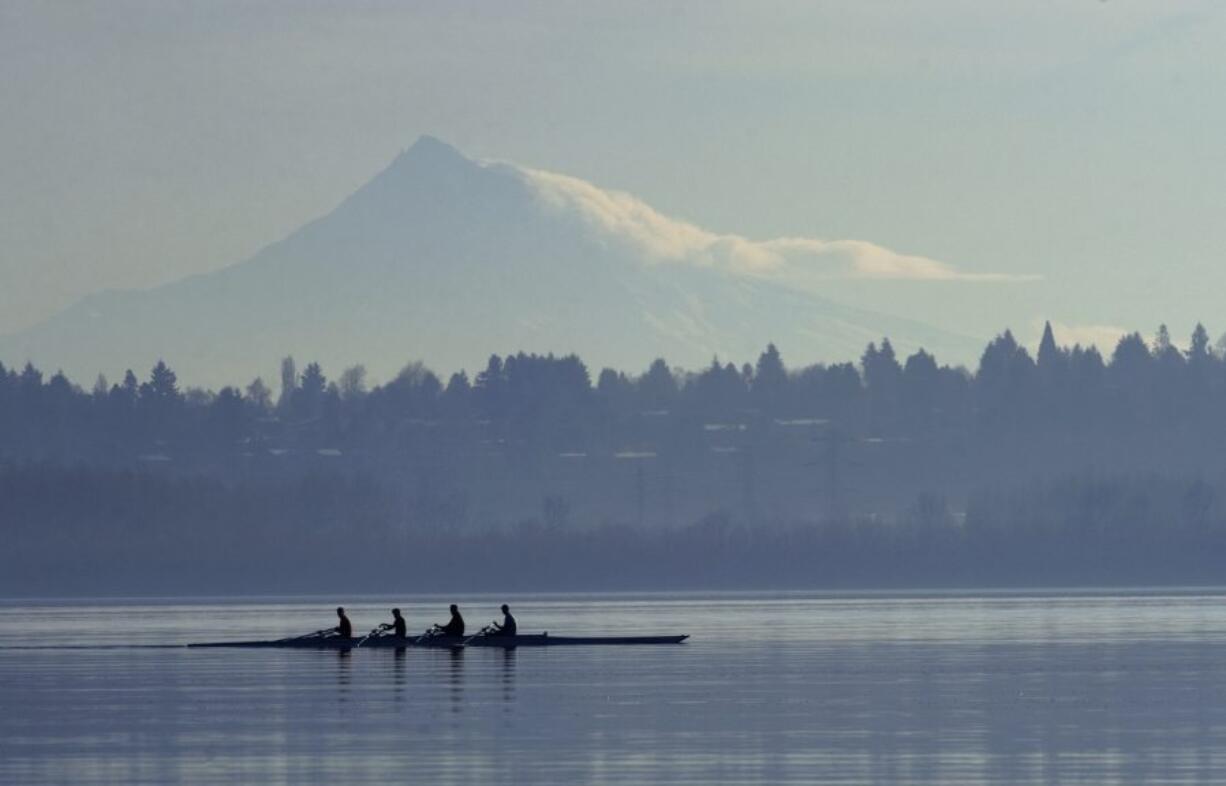 Members of the Vancouver Lake Crew glide across the water Dec. 28, 2009, while practicing at Vancouver Lake.