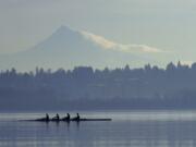 Members of the Vancouver Lake Crew glide across the water Dec. 28, 2009, while practicing at Vancouver Lake.