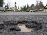 The city of Vancouver&#039;s new online app can&#039;t patch potholes like this one, at the intersection of Northeast 18th Street and Northeast 134th Avenue, but it can get a report to public works dispatchers.