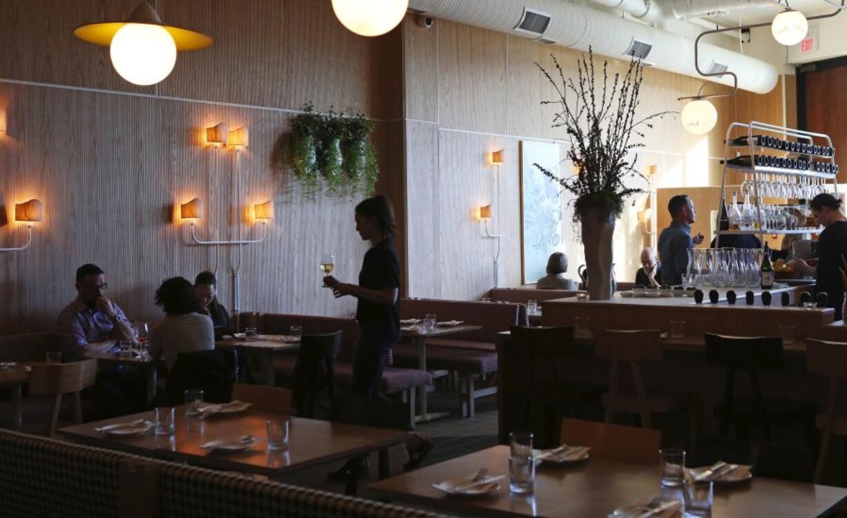 The elegantly simple open interior at Osteria Savio Volpe in Vancouver.