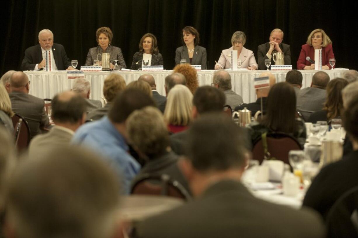 Legislators take questions on a panel at the legislative outlook breakfast at the Hilton Vancouver Washington on Dec. 11. From left, Sen. Don Benton, Rep. Liz Pike, Rep. Lynda Wilson, Sen. Ann Rivers, Sen. Annette Cleveland, Rep. Paul Harris and Rep. Sharon Wylie.