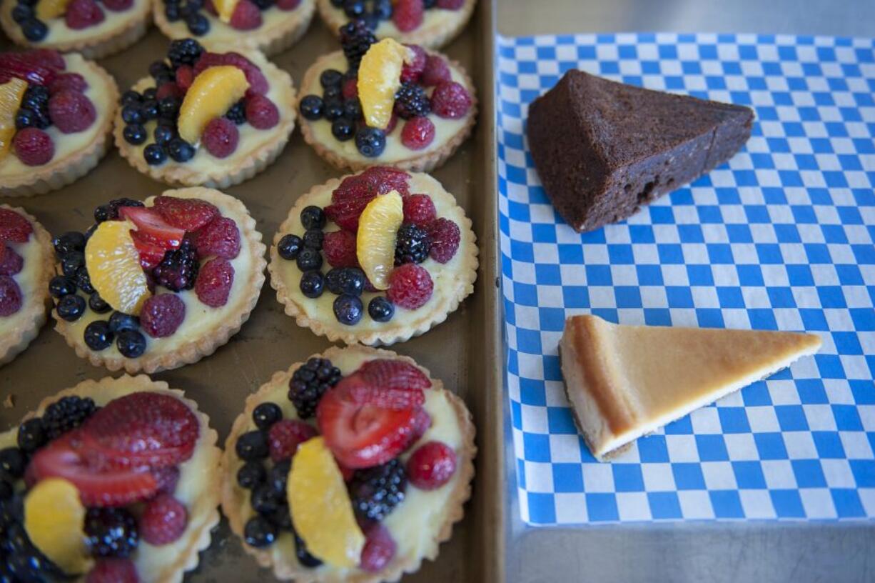 Fruit tarts are seen next to honey ricotta cheesecake and chocolate hazelnut cake at Pizzeria La Sorrentina in Hazel Dell.