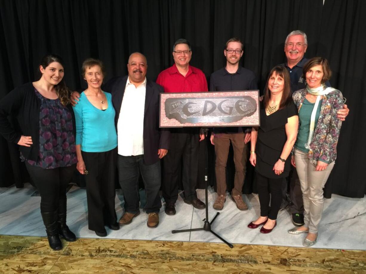 Happy with their new space, Magenta Theater&#039;s edgy storytellers -- Liz Romero, from left, Jackie Allen Bond, Chip Lazenby, Richard Cruz, Anthony Baney, Pat Vichas, Curtis Hope and coach Reba Hoffman -- embrace a photo from the old venue.