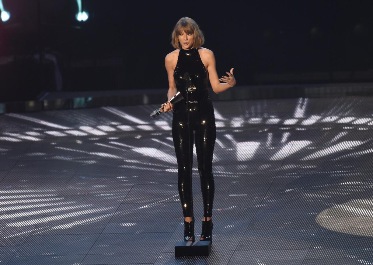 Taylor Swift accepts the award Sunday for best tour during the iHeartRadio Music Awards at The Forum in Inglewood, Calif.