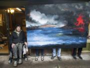 World War II veteran and retired art teacher Gordon Sage with the 7-foot-wide painting of Pearl Harbor, held upright by neighbors and his daughter, Donna. Sage was serving on a ship in Pearl Harbor when the Japanese attacked on Dec. 7, 1941.