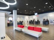 Comcast employees and customers interact in the company&#039;s new Vancouver Plaza store, which opened Monday. The Xfinity Store is part of Comcast&#039;s new approach to customer service.