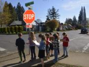 Hathaway Elementary students from Debbie Kramer&#039;s second-grade class study street signs and other city map features during a mapping activity April 18.