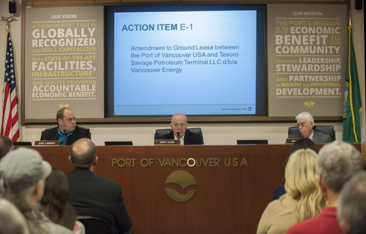 Port Commissioners Eric LaBrant, from left, Jerry Oliver and Brian Wolfe debate in front of a packed crowd April 15 at the Port of Vancouver.