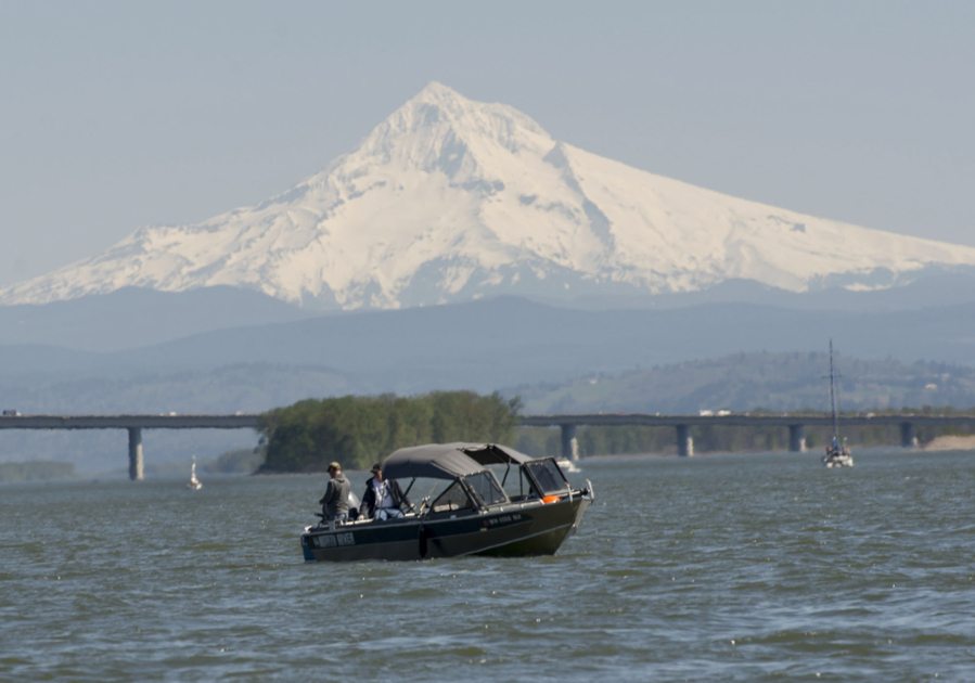 Boaters enjoy a clear day on the Columbia River as Mount Hood is seen overhead Thursday afternoon.