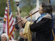 Katherine Quartz, from the Walker River Paiute Tribe, plays a flute song titled &quot;Waterflow&quot; to honor the infant son of Little Bear during the 2013 Nez Perce Chief Redheart Memorial Ceremony at the Fort Vancouver National Historic Reserve. This year&#039;s event is April 23.