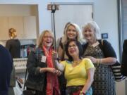 Rhona Sen Hoss, campaign manager for Sen. Annette Cleveland, center, takes a selfie with Stacey Graham, president of the Humane Society for Southwest Washington, from left; Kate Sacamano, YWCA director of philanthropy; and Teresa Lawwill of the Greater Vancouver Chamber of Commerce during a meeting of the giving circle Empower Women + Girls.