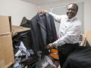 Clark College student Nick Ashitey-Kendrich looks over the men&#039;s section at the Career Clothing Closet. The program provides students with job-interview and career clothing at no cost.