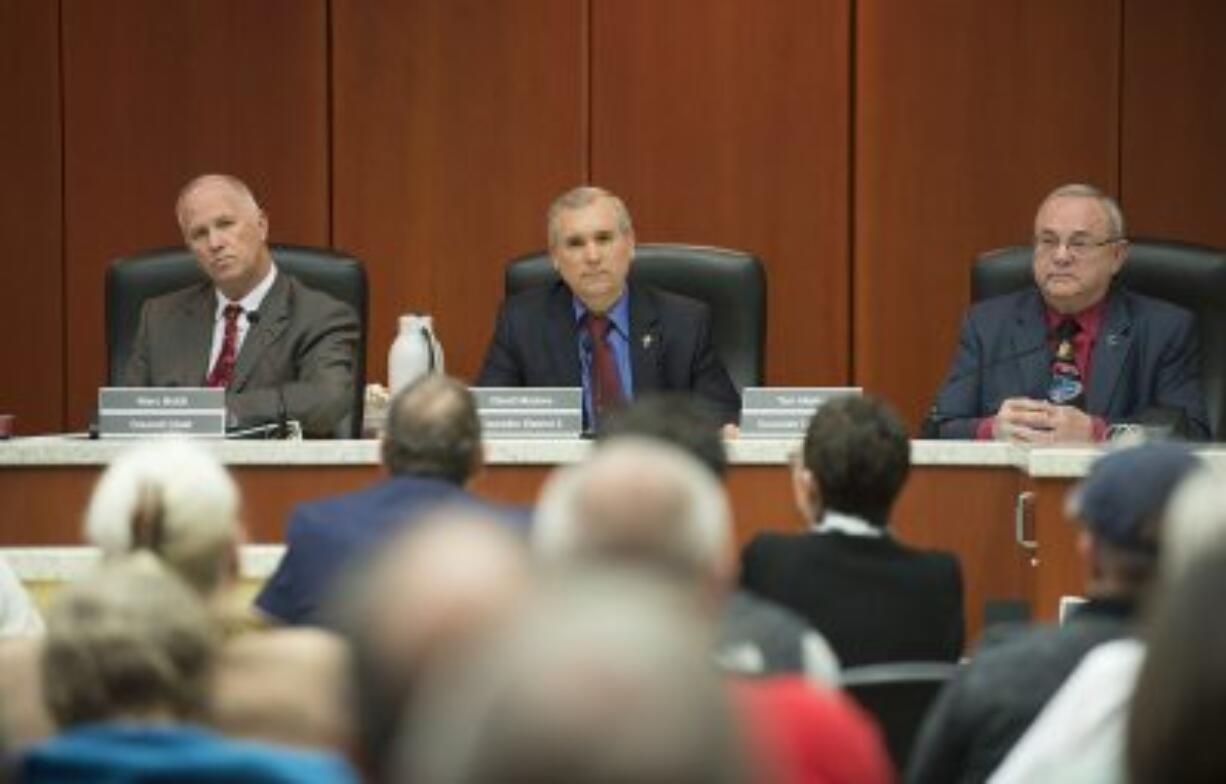 Clark County council Chair Marc Boldt, from left, listens to testimony with Councilors David Madore and Tom Mielke on Tuesday evening.