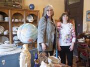 Second Hand Solutions store manager Julie Murray, right, with Judy McMorine, Open House Ministries development director, talk about the new vintage and antique shop opened at the nonprofit&#039;s retail building.