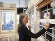 Jan Berichon, a child safety health educator at the Randall Children&#039;s Hospital Safety Center, demonstrates how window-safety devices work Wednesday afternoon at the safety center in Portland. Window stops prevent windows from opening more than 4 inches, and window guards keep children from falling out of fully open windows.