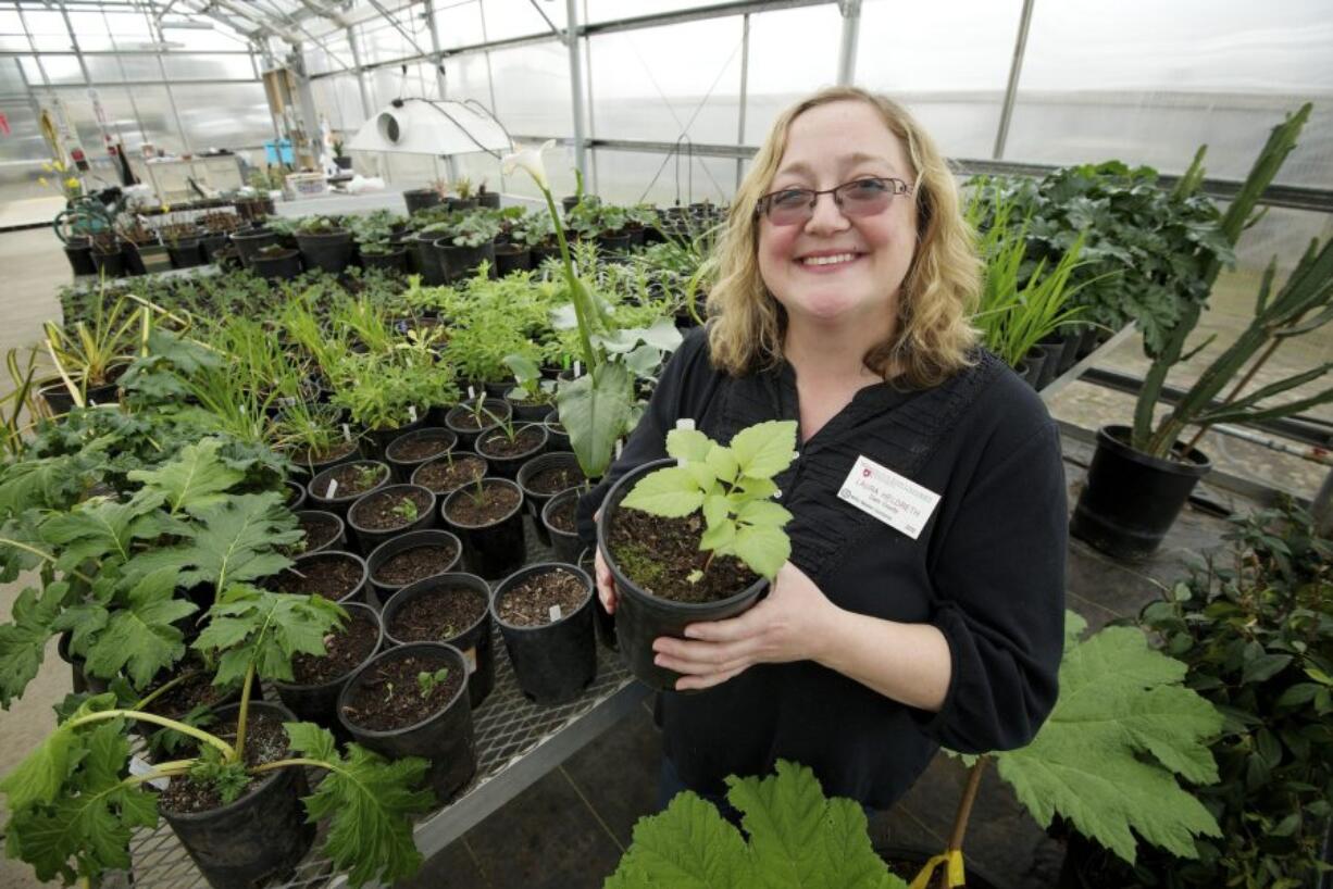 Laura Heldreth, a WSU Master Gardener, shares tips for getting a good start on gardening at the Heritage Farm Tuesday March 4, 2014 in Vancouver, Washington.