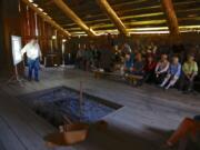 Archaeologist Ken Ames talks Sunday inside the Cathlapotle Plankhouse about what the Cathlapotle village was like before the Chinookan people made direct contact with Europeans. His lecture was part of the season opening of the plankhouse replica at the Ridgefield National Wildlife Refuge.