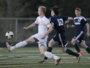 Ridgefield&#039;s soccer player Max Hauser, (left) battles with Mark Morris&#039; Elijah West (10).